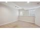 Bedroom with carpet flooring, base trim, painted walls, and natural light from two windows at 15573 E Prentice Ln, Centennial, CO 80015