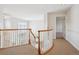 Second floor hallway featuring an open view and stylish carpet, offers an elegant transition between spaces at 15573 E Prentice Ln, Centennial, CO 80015