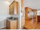 Elegant kitchen featuring custom wood cabinetry, granite countertops, and stainless steel appliances, perfect for culinary enthusiasts at 15573 E Prentice Ln, Centennial, CO 80015