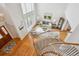 Open-concept living room with soaring ceilings and large windows, flooding the space with natural light and warmth at 15573 E Prentice Ln, Centennial, CO 80015
