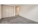 Finished basement bedroom with double door closet and carpet floor at 3361 S Dahlia St, Denver, CO 80222