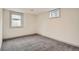 Basement room features neutral walls, carpet floors, and a window letting in natural light at 3361 S Dahlia St, Denver, CO 80222