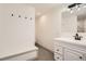 Bright bathroom with modern vanity, stylish fixtures, and a convenient bench at 3361 S Dahlia St, Denver, CO 80222