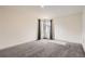 Bright bedroom with neutral walls, carpet floors, and natural light from the windows at 3361 S Dahlia St, Denver, CO 80222