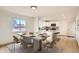 Bright dining area connected to the kitchen with a dining table and seating for six at 3361 S Dahlia St, Denver, CO 80222