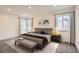 Relaxing main bedroom with a stylish bed, neutral tones, and natural light from the windows at 3361 S Dahlia St, Denver, CO 80222