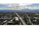 Scenic aerial view featuring a mix of residential buildings, commercial properties, and transportation routes at 6007 Yarrow St # D, Arvada, CO 80004