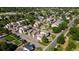 Aerial view of a residential community with manicured lawns, mature trees and accessible street parking at 6007 Yarrow St # D, Arvada, CO 80004