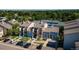 Stunning aerial view of townhomes and community with manicured lawns and mature trees at 6007 Yarrow St # D, Arvada, CO 80004
