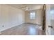 Spacious bedroom features neutral walls, flooring, and natural light at 6007 Yarrow St # D, Arvada, CO 80004