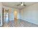 Bedroom features laminate flooring, ceiling fan and double door closet at 6007 Yarrow St # D, Arvada, CO 80004
