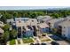 An aerial view of modern condos and a well-maintained landscape on a sunny day at 6007 Yarrow St # D, Arvada, CO 80004