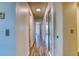 Hallway shows access to multiple rooms featuring laminate flooring at 6007 Yarrow St # D, Arvada, CO 80004
