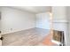 Living room with decorative fireplace, wood flooring, and neutral color scheme for versatile decor options at 6007 Yarrow St # D, Arvada, CO 80004