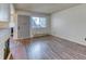 Well-lit living area featuring a fireplace, wood-look flooring, and plenty of natural light at 6007 Yarrow St # D, Arvada, CO 80004