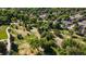 Community park featuring walking paths, mature trees, open grassy areas, and well-maintained landscape at 6007 Yarrow St # D, Arvada, CO 80004