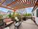 Relax on this beautiful wooden deck with pergola and outdoor seating, perfect for entertaining at 6308 Walnut Grove Way, Erie, CO 80516