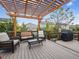 Relax on this beautiful wooden deck with pergola and outdoor seating, perfect for entertaining at 6308 Walnut Grove Way, Erie, CO 80516