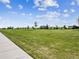 Community green space with walking path and a view of neighborhood homes at 6308 Walnut Grove Way, Erie, CO 80516