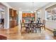 Cozy dining area with hardwood floors and views of the modern kitchen at 6308 Walnut Grove Way, Erie, CO 80516