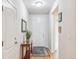 Bright entryway featuring hardwood floors, a stylish rug, and a charming console table at 6308 Walnut Grove Way, Erie, CO 80516