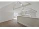 Finished attic with neutral carpet, white walls, and natural light at 1346 Steele St, Denver, CO 80206