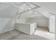 Finished attic featuring white walls, carpeted floors, and exposed beams at 1346 Steele St, Denver, CO 80206
