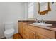 Bathroom featuring a marble countertop vanity and a white toilet at 1346 Steele St, Denver, CO 80206