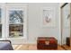 Bright bedroom with hardwood floors, windows and an ornate wooden chest at 1346 Steele St, Denver, CO 80206