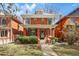 Charming two story red brick home with covered front porch and manicured lawn at 1346 Steele St, Denver, CO 80206