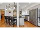 Modern kitchen with island seating, stainless steel appliances and farmhouse sink at 1346 Steele St, Denver, CO 80206