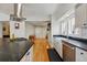Bright eat-in kitchen featuring stainless steel appliances and dark countertops at 1346 Steele St, Denver, CO 80206