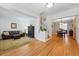 Open-concept design connects the living room, staircase, and dining area at 1346 Steele St, Denver, CO 80206