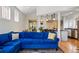 Spacious open-concept living room boasts hardwood floors and seamlessly connects to the kitchen at 1346 Steele St, Denver, CO 80206