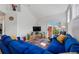 Bright living room boasts recessed lighting, hardwood floors, and slider door access to the outdoors at 1346 Steele St, Denver, CO 80206