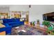 Spacious open-concept living room boasts hardwood floors and seamlessly connects to the kitchen at 1346 Steele St, Denver, CO 80206