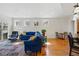 Bright living room boasts recessed lighting, hardwood floors, and slider door access to the outdoors at 1346 Steele St, Denver, CO 80206