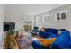 Bright living room boasts recessed lighting, hardwood floors, and slider door access to the outdoors at 1346 Steele St, Denver, CO 80206