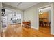Open-concept living space seamlessly connects the dining area and kitchen with natural hardwood floors at 1346 Steele St, Denver, CO 80206