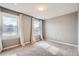 Bright bedroom featuring neutral walls, carpet flooring, and two windows with natural light at 13158 W 62Nd Dr, Arvada, CO 80004