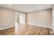 Bright, spacious living room featuring hardwood floors and recessed lighting at 13158 W 62Nd Dr, Arvada, CO 80004