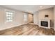 Cozy living room features a fireplace, hardwood floors, and natural light at 13158 W 62Nd Dr, Arvada, CO 80004