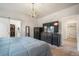 Bedroom featuring walk-in closet and an en-suite bathroom at 11524 Dewey St, Parker, CO 80138
