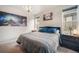 Comfortable bedroom featuring a modern chandelier, cozy bed, and stylish decor at 11524 Dewey St, Parker, CO 80138