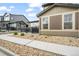 Charming home exterior with landscaped yard, complemented by sidewalk and attractive architectural details at 11524 Dewey St, Parker, CO 80138