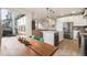 Open concept kitchen with stainless appliances flows into the living room, offering ample natural light and inviting spaces at 11524 Dewey St, Parker, CO 80138