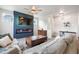 Inviting living room featuring a modern electric fireplace, comfortable sofa, and stylish decor at 11524 Dewey St, Parker, CO 80138
