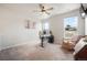 Bright office area with carpet floors, work desk, and natural light at 11524 Dewey St, Parker, CO 80138
