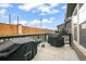 Relaxing outdoor patio area featuring barbecue grills and a view of the fenced backyard at 11524 Dewey St, Parker, CO 80138