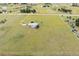Aerial view of a home with surrounding acreage and a long driveway at 46531 Sundance Trl, Parker, CO 80138